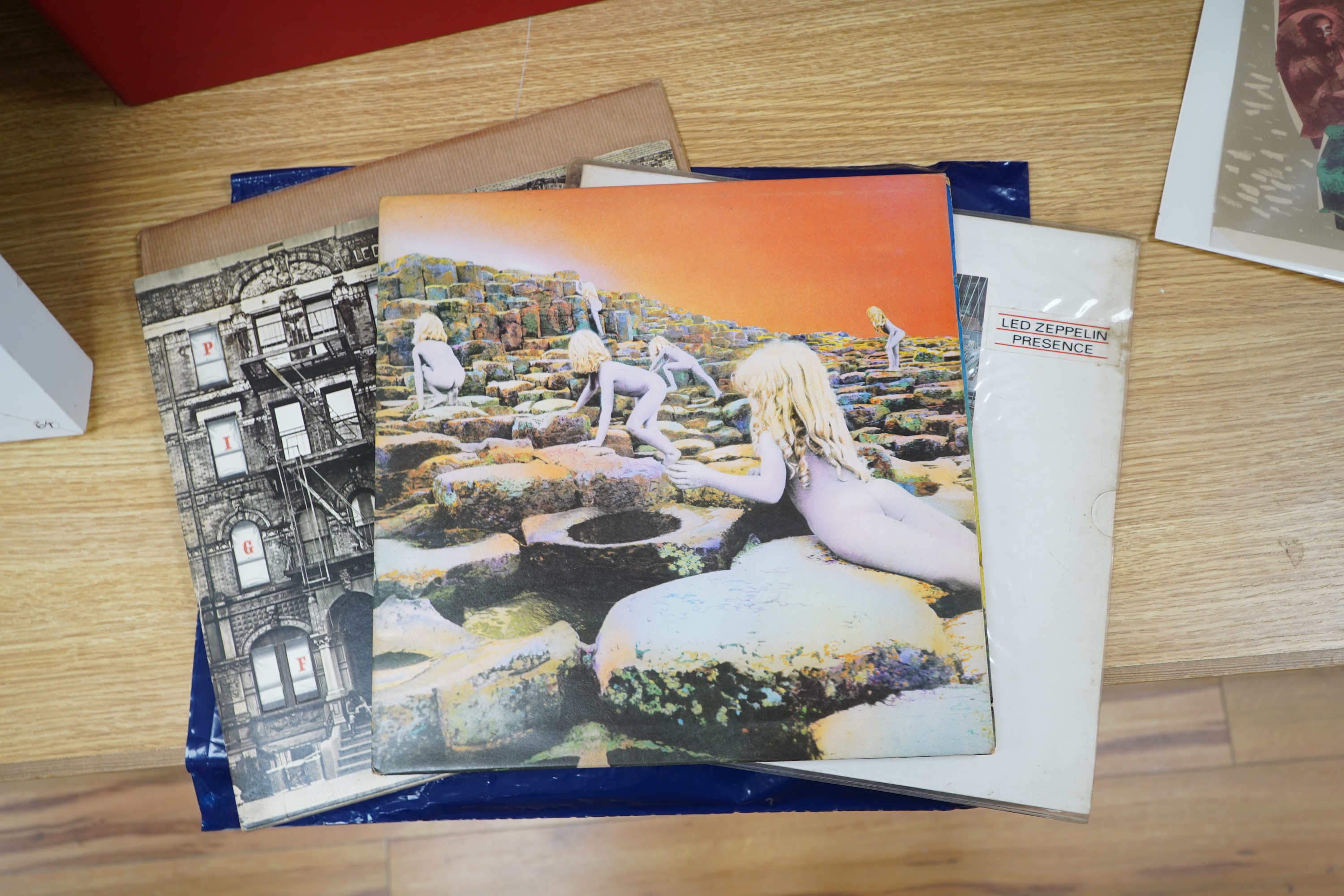 Five Led Zeppelin LP record albums; In Through the Out Door (SSK59410), Physical Graffiti (SSK89400), Presence (SSK59402), Houses of the Holy (K50014), and The Soundtrack from the Film The Song Remains the Same (SSK89402